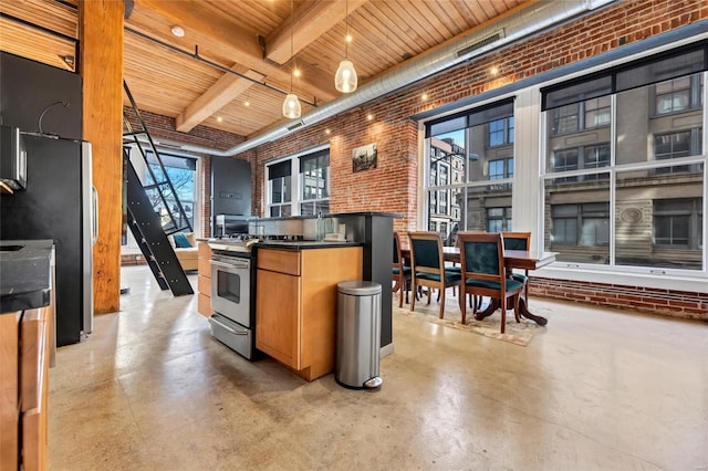 kitchen with wooden ceiling, concrete flooring, and brick wall