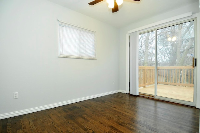 empty room with ceiling fan and dark hardwood / wood-style flooring