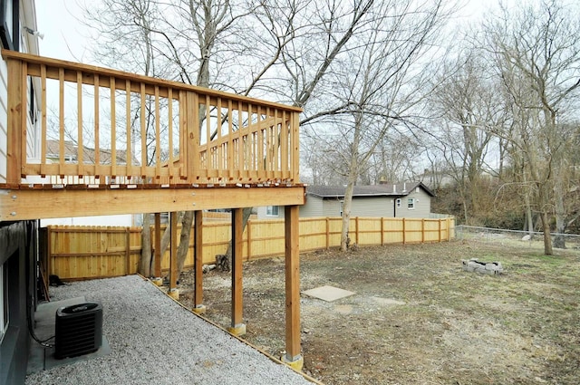 view of yard with cooling unit and a wooden deck