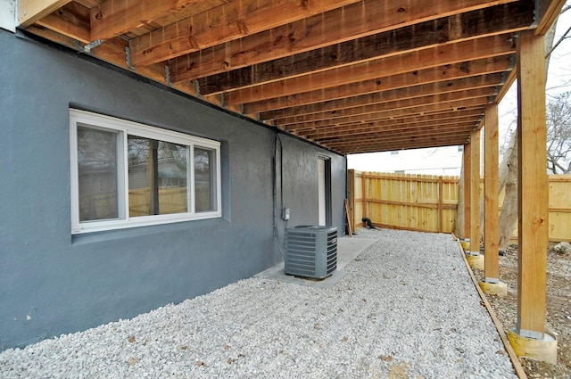 view of property exterior with central AC and a patio area