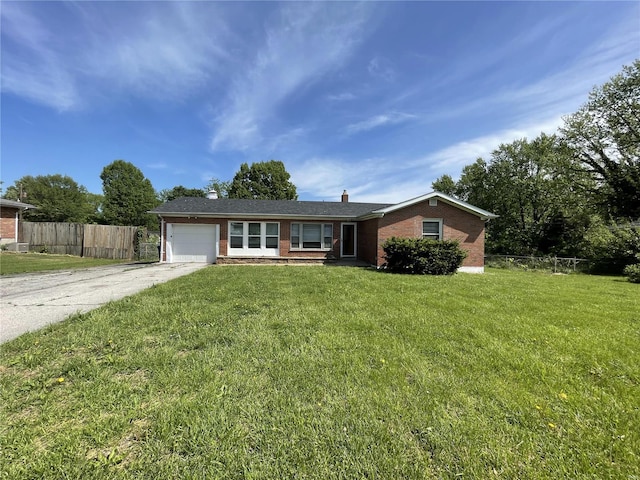 ranch-style house featuring a garage and a front yard