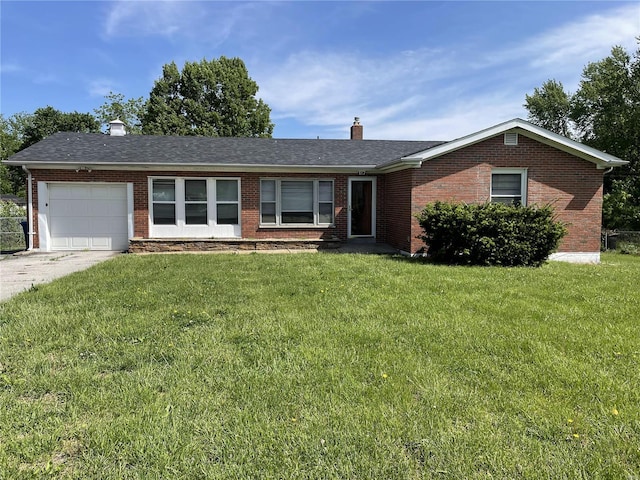 single story home featuring a garage and a front yard