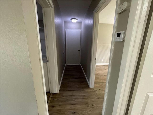 hallway featuring dark wood-type flooring