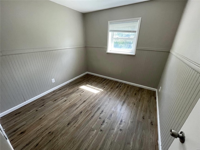 empty room with hardwood / wood-style floors