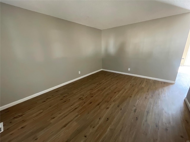 empty room featuring dark hardwood / wood-style floors