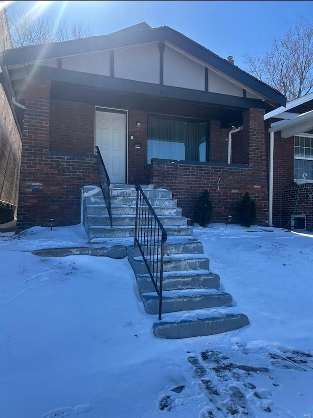 view of front of house with brick siding