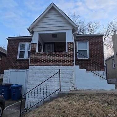 view of front of home featuring brick siding