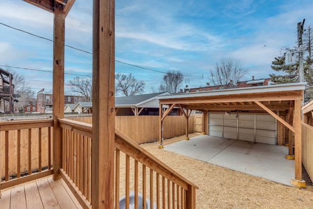 deck with an outbuilding and a garage