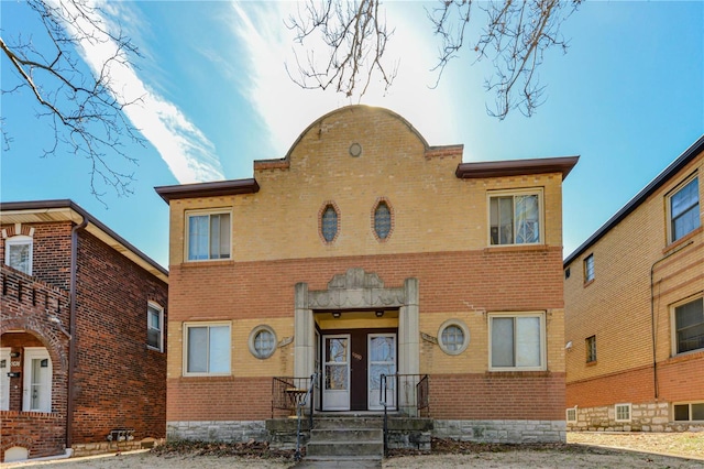 view of front of house featuring brick siding