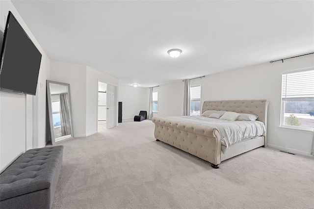 bedroom with light colored carpet