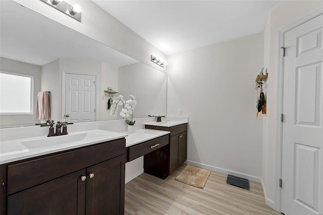 bathroom featuring vanity and hardwood / wood-style flooring