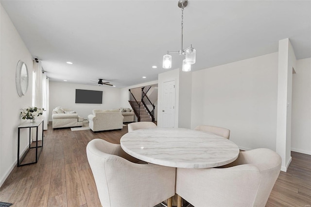 dining space featuring hardwood / wood-style flooring and ceiling fan