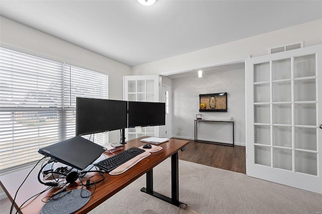 office space with wood-type flooring