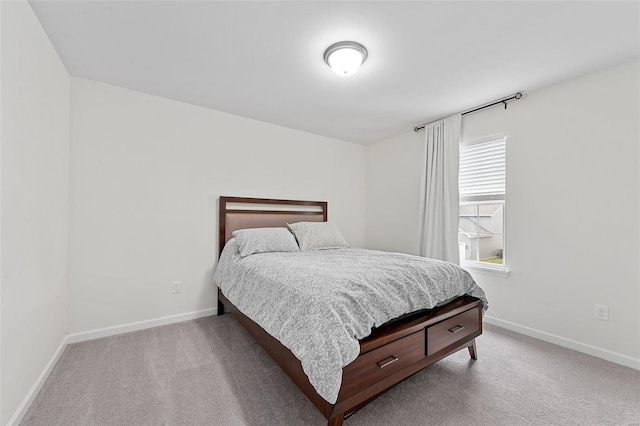 bedroom featuring light colored carpet