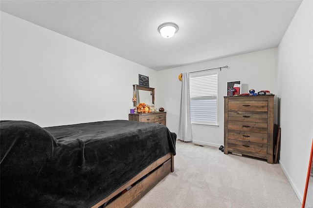 bedroom with light carpet