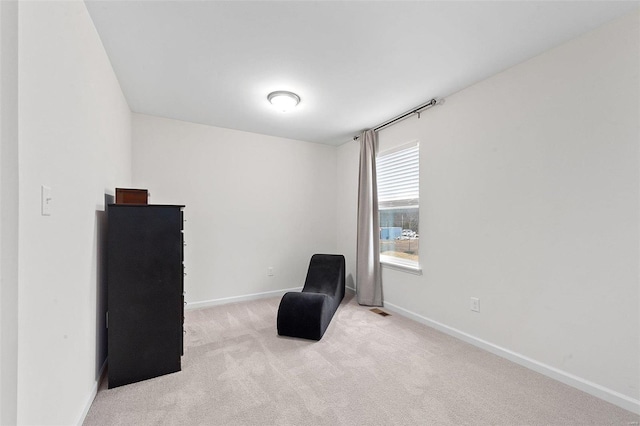 sitting room with light carpet