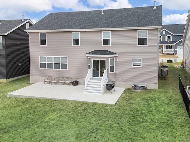 back of property featuring a yard and a patio