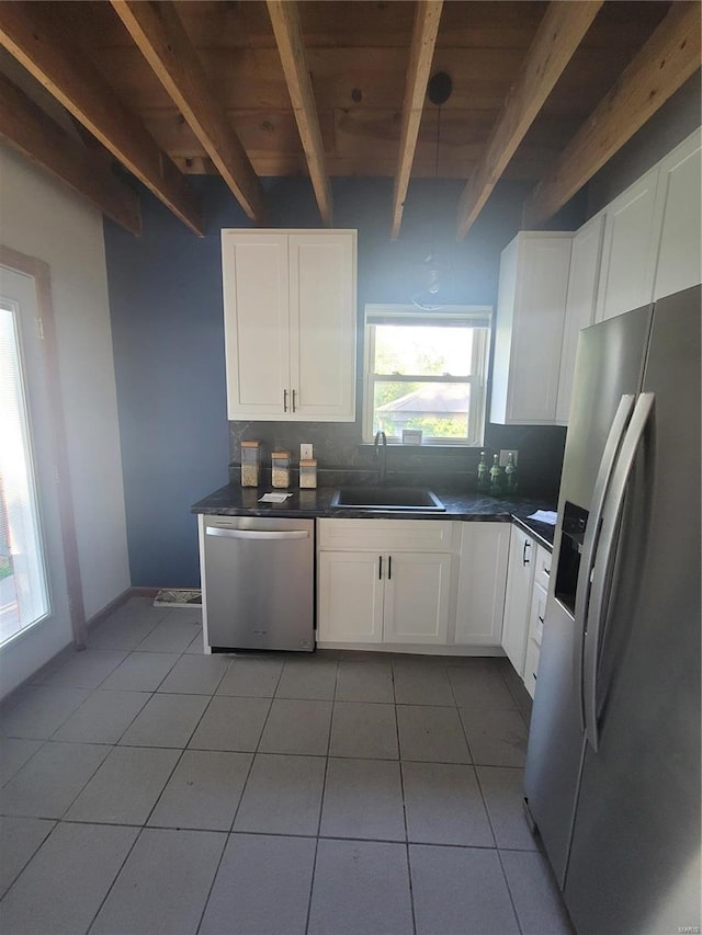 kitchen with white cabinetry, sink, and stainless steel appliances