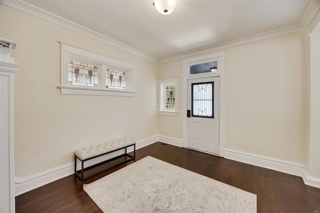 foyer featuring ornamental molding, a healthy amount of sunlight, and dark hardwood / wood-style floors