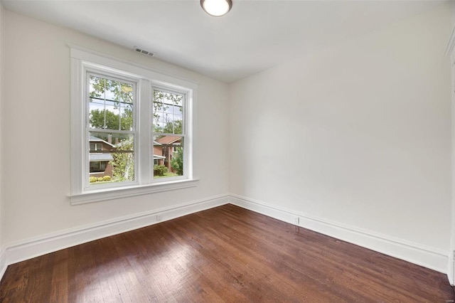 empty room featuring wood-type flooring