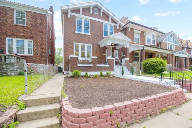 view of front of house with a porch and central AC unit