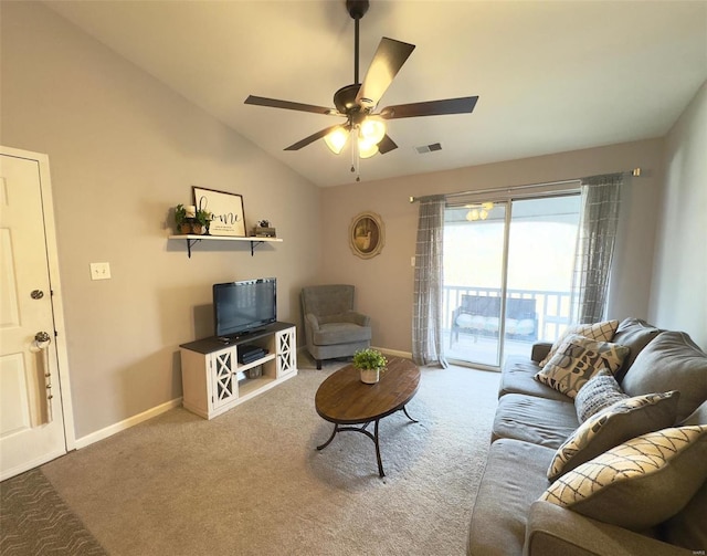 living room featuring lofted ceiling, carpet floors, a ceiling fan, and baseboards