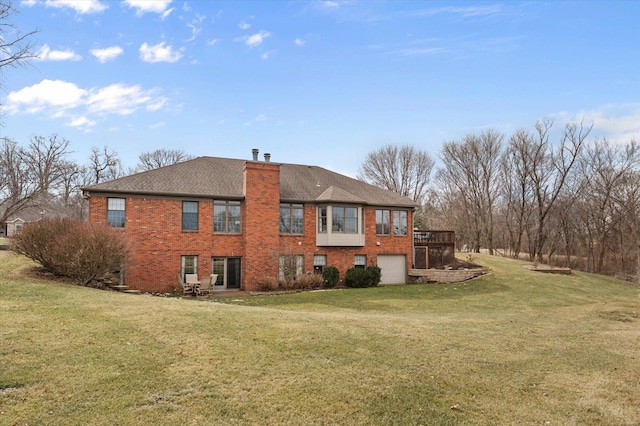 rear view of house with an attached garage, a chimney, a lawn, and brick siding