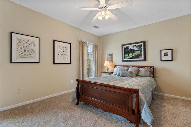 bedroom featuring baseboards, visible vents, and light colored carpet