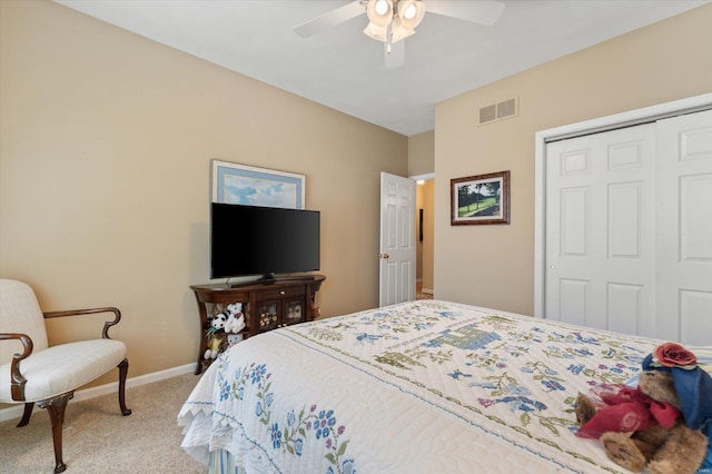 bedroom with baseboards, visible vents, a ceiling fan, light colored carpet, and a closet