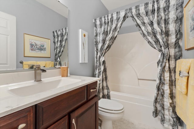 bathroom featuring toilet, tile patterned flooring, vanity, and shower / tub combo with curtain