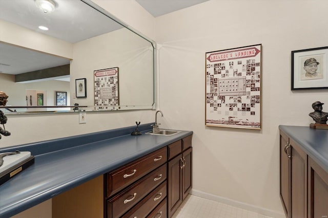 bathroom featuring vanity and baseboards