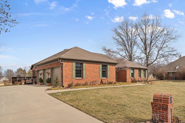 single story home featuring an attached garage, a front yard, concrete driveway, and brick siding