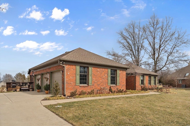 view of front of property with brick siding, an attached garage, a front yard, a deck, and driveway