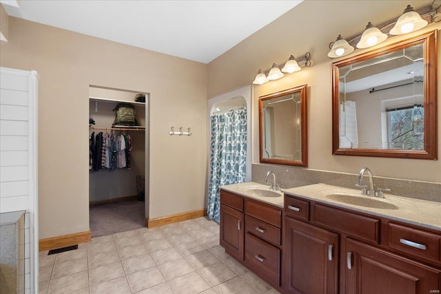 bathroom with vanity and tile patterned floors