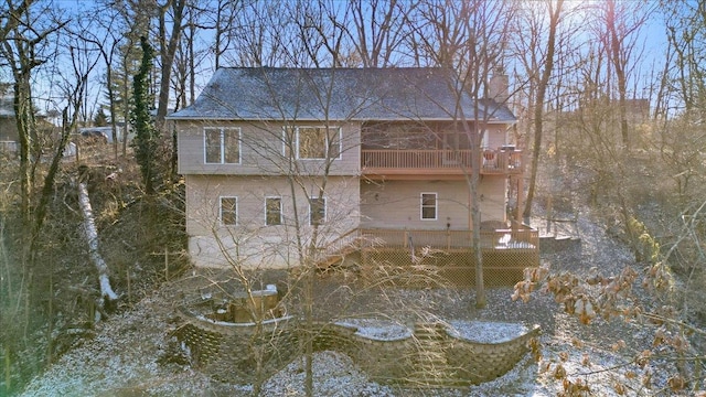 back of house featuring a balcony