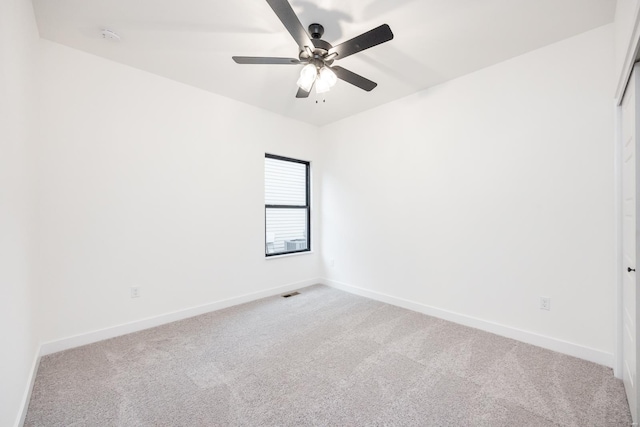 empty room with carpet and ceiling fan