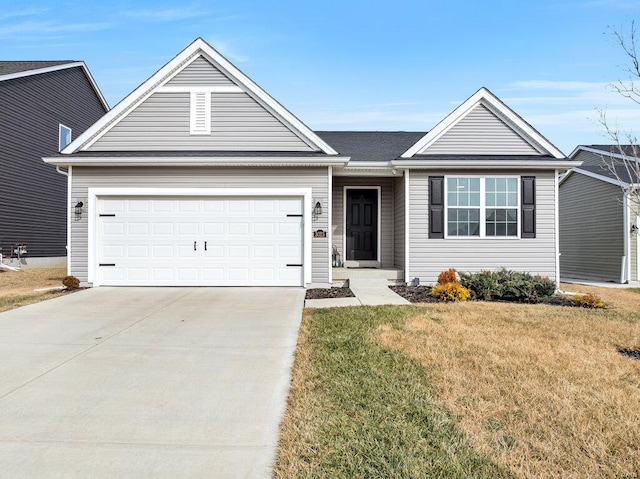 single story home with a garage and a front lawn