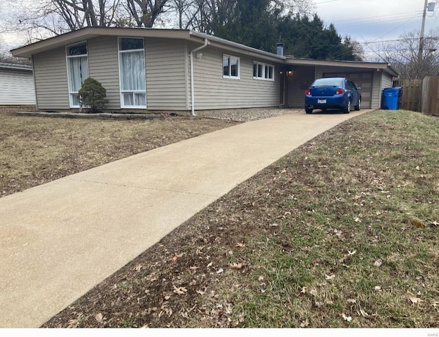 view of side of home featuring a garage