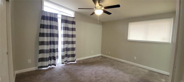 spare room featuring a ceiling fan, carpet, lofted ceiling, and baseboards