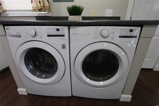 laundry room featuring laundry area, mail area, washer and clothes dryer, and dark wood finished floors