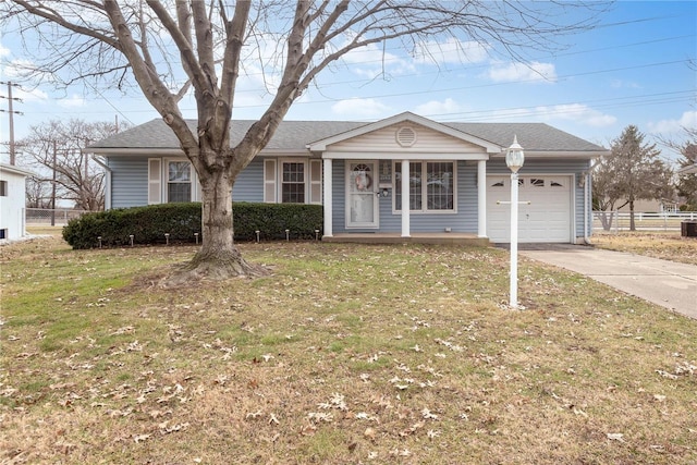 single story home featuring a garage, a porch, and a front yard