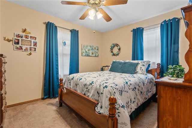 bedroom with light carpet and ceiling fan