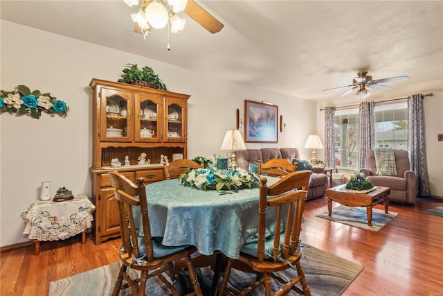 dining room with wood-type flooring and ceiling fan