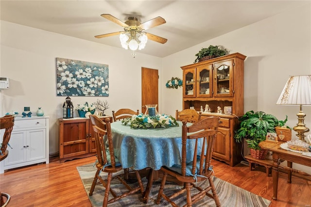 dining area featuring light hardwood / wood-style floors and ceiling fan