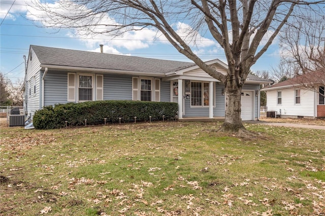 single story home featuring a garage and a front yard