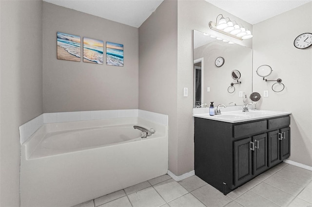 bathroom featuring vanity, a tub, and tile patterned floors