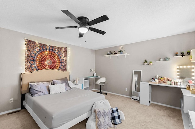 bedroom featuring light colored carpet and ceiling fan