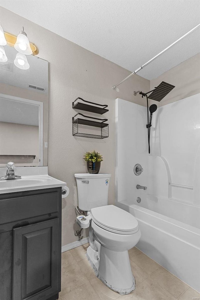 full bathroom featuring toilet, shower / bathing tub combination, a textured ceiling, vanity, and tile patterned flooring