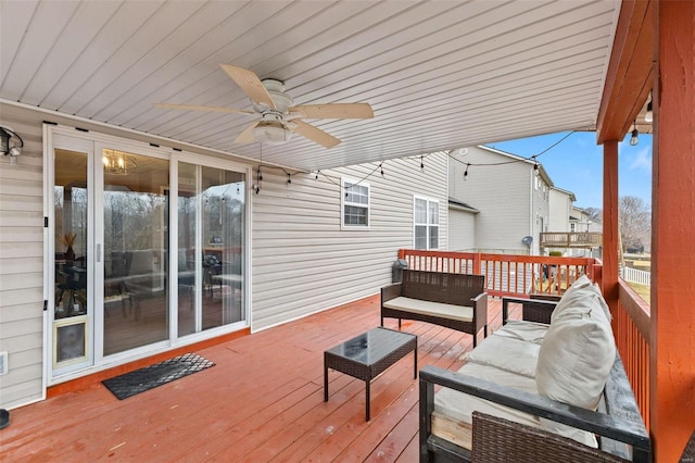 deck featuring outdoor lounge area and ceiling fan