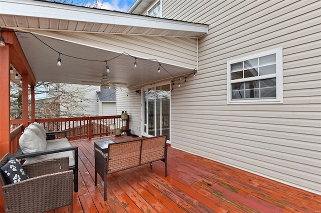 wooden terrace featuring an outdoor hangout area and ceiling fan